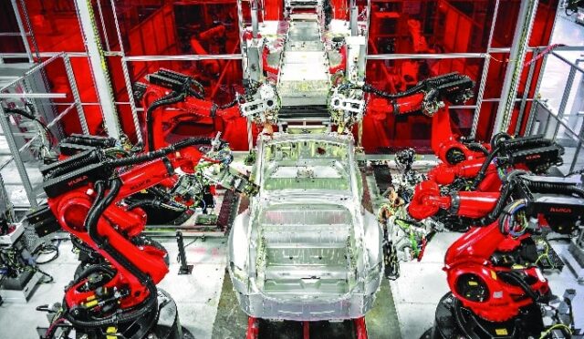 68d3ba95bca62406c780ae09_A-robotic-assembly-station-in-the-Tesla-factory-Teslas-special-KUKA-robots-can-perform